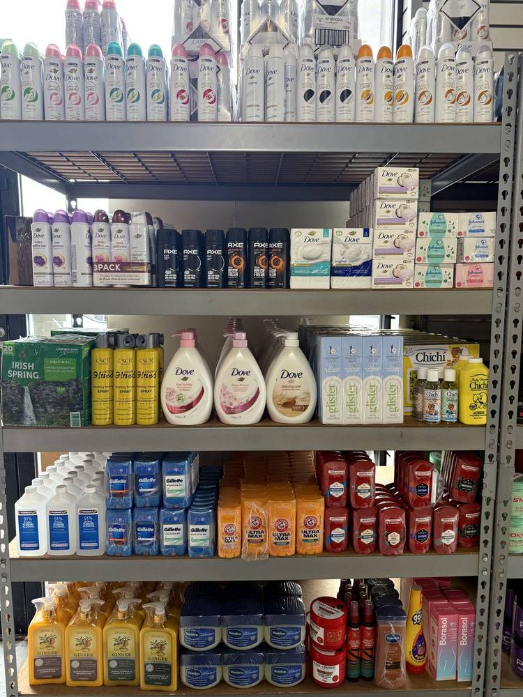 Personal care and hygiene shelves — deodorant, body wash, Vaseline — at Allan Beauty Supply
